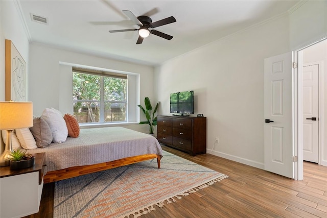 3121 Yandall Dr, Austin, TX 78748 - bedroom with wood finished floors, ornamental molding, and a ceiling fan