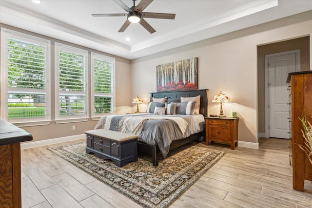 202 Iron Rail Ln, Georgetown, TX 78633 - bedroom with ornamental molding, light wood-style floors, a raised ceiling, and a ceiling fan