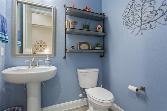 202 Iron Rail Ln, Georgetown, TX 78633 - bathroom featuring baseboards and wood finished floors