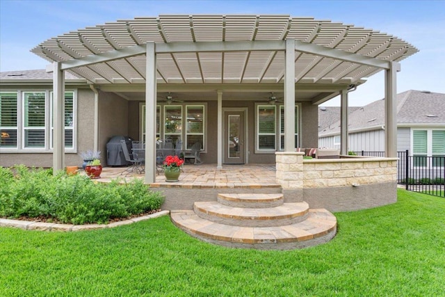 202 Iron Rail Ln, Georgetown, TX 78633 - rear view of house featuring a ceiling fan, a pergola, a patio area, and stucco siding
