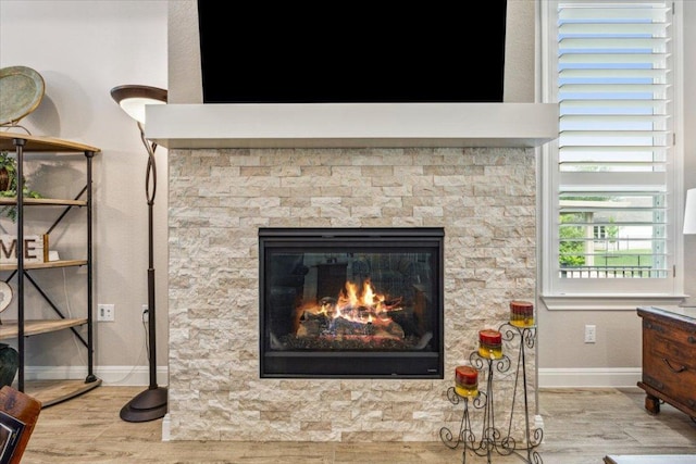 202 Iron Rail Ln, Georgetown, TX 78633 - detailed view of wood finished floors and a fireplace