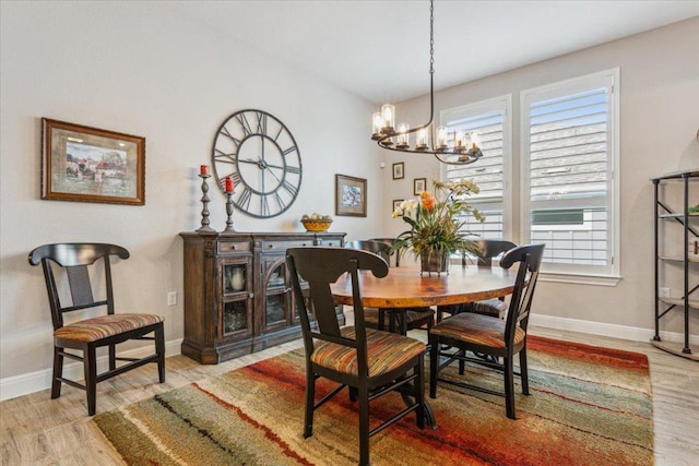 202 Iron Rail Ln, Georgetown, TX 78633 - dining room with a chandelier, light wood-style floors, and healthy amount of natural light