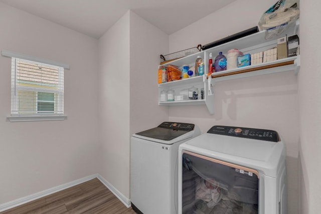 133 Fairmeadow Downs Dr, Hutto, TX 78634 - washroom with washing machine and dryer and wood finished floors