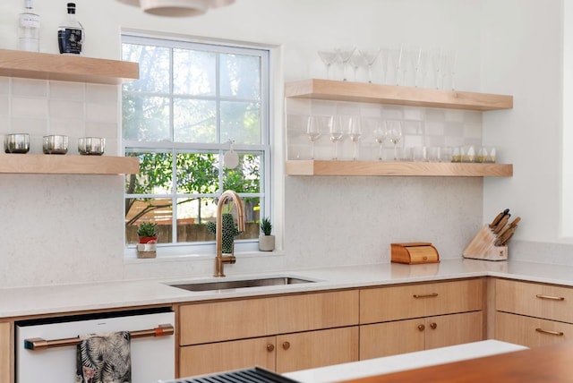 1608 Hether St, Austin, TX 78704 - kitchen featuring open shelves, white dishwasher, light brown cabinetry, and decorative backsplash