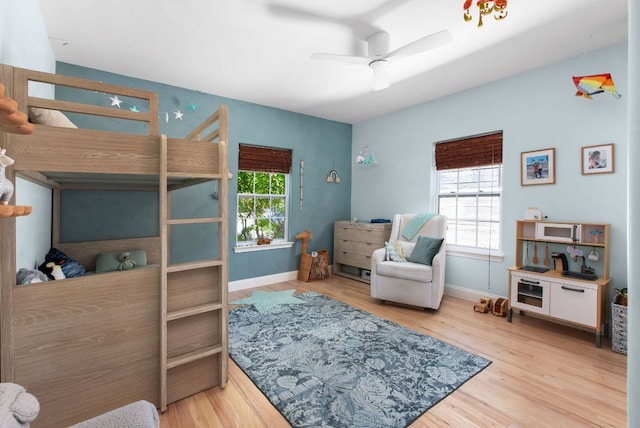 1608 Hether St, Austin, TX 78704 - bedroom with multiple windows, wood finished floors, and ceiling fan