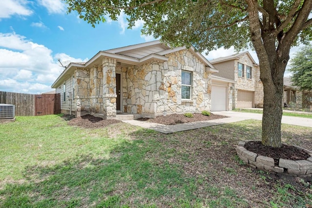 486 Nottingham Loop, Kyle, TX 78640 - view of front of home featuring stone siding, driveway, and a garage