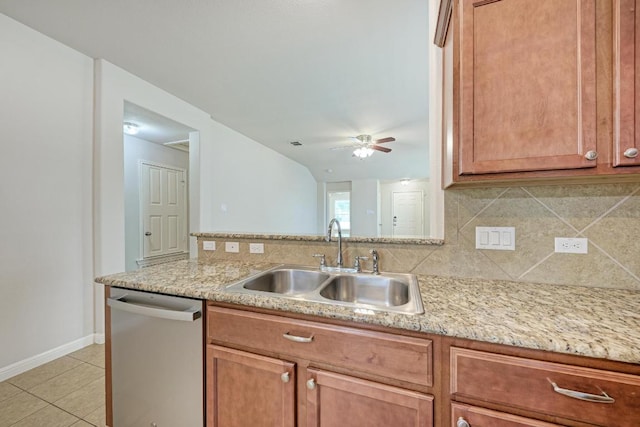 486 Nottingham Loop, Kyle, TX 78640 - kitchen with dishwasher, tasteful backsplash, light tile patterned floors, a ceiling fan, and light stone counters