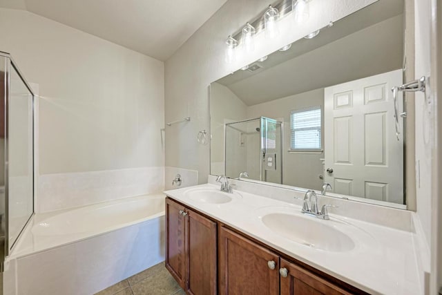 486 Nottingham Loop, Kyle, TX 78640 - full bathroom featuring a garden tub, double vanity, a stall shower, and tile patterned flooring