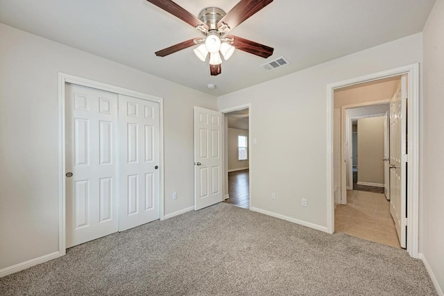 486 Nottingham Loop, Kyle, TX 78640 - unfurnished bedroom featuring light colored carpet, a closet, and ceiling fan