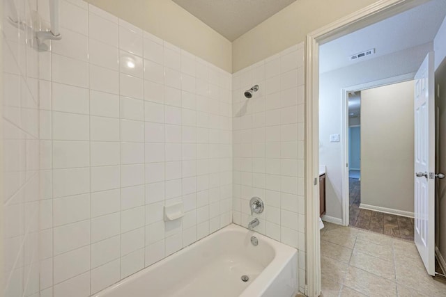 486 Nottingham Loop, Kyle, TX 78640 - bathroom featuring shower / washtub combination and tile patterned floors