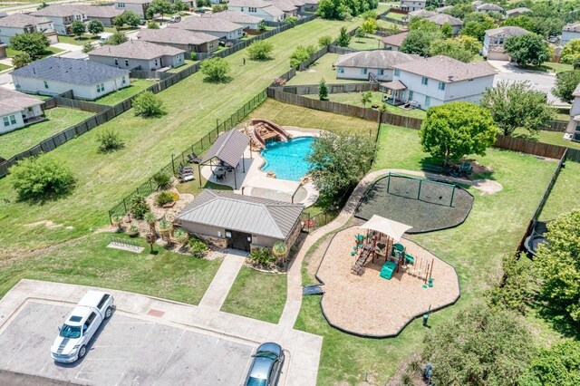 486 Nottingham Loop, Kyle, TX 78640 - aerial perspective of suburban area with a pool