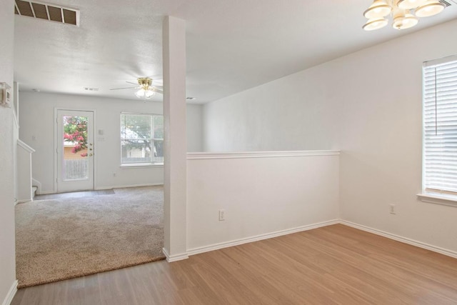 2733 Crimson Sky Ct, Round Rock, TX 78665 - unfurnished room featuring a chandelier, wood finished floors, and ceiling fan