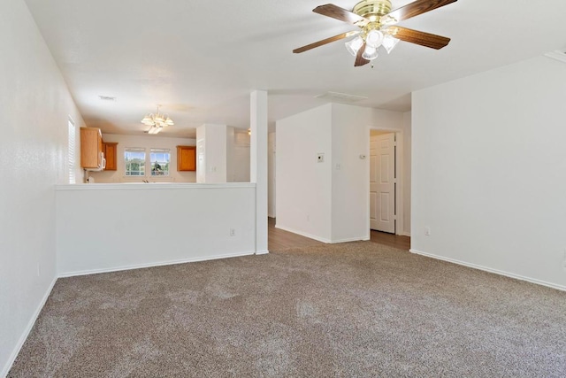 2733 Crimson Sky Ct, Round Rock, TX 78665 - unfurnished living room with carpet flooring, a chandelier, and a ceiling fan