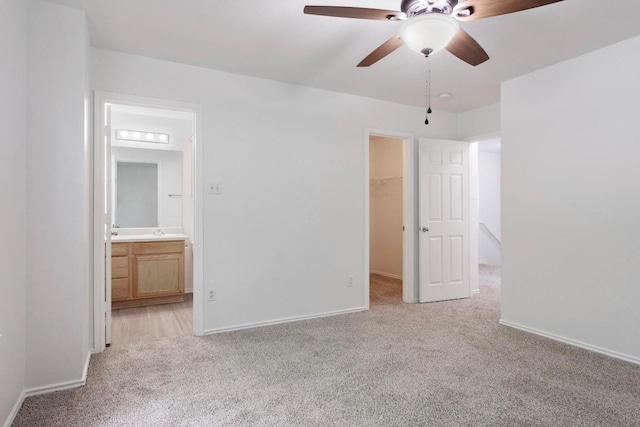 2733 Crimson Sky Ct, Round Rock, TX 78665 - unfurnished bedroom featuring light colored carpet, a spacious closet, a closet, ensuite bath, and ceiling fan