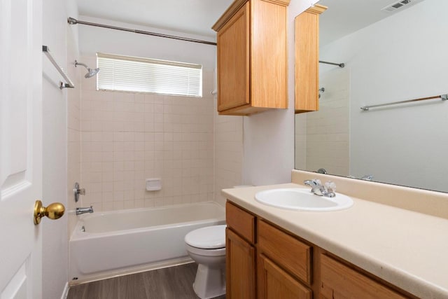 2733 Crimson Sky Ct, Round Rock, TX 78665 - full bathroom with vanity, shower / bath combination, and wood finished floors