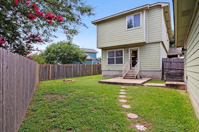 2733 Crimson Sky Ct, Round Rock, TX 78665 - back of house featuring entry steps, a fenced backyard, and a patio area