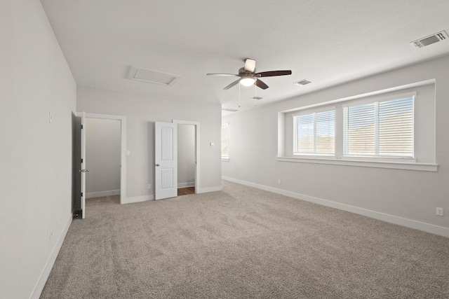 18017 Prato Dr, Pflugerville, TX 78660 - unfurnished bedroom featuring light carpet, attic access, and a ceiling fan
