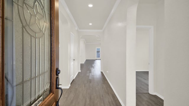 12505 Franklin D Roosevelt St, Manor, TX 78653 - hall with arched walkways, crown molding, and wood finished floors