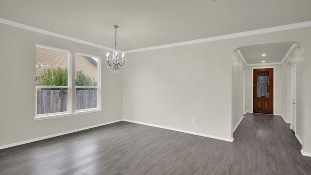 12505 Franklin D Roosevelt St, Manor, TX 78653 - spare room with arched walkways, dark wood-style flooring, a chandelier, and ornamental molding