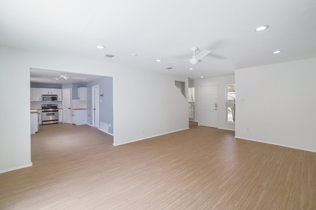 2616 Aylesbury Ln, Austin, TX 78745 - unfurnished living room with a ceiling fan, recessed lighting, and light wood-type flooring