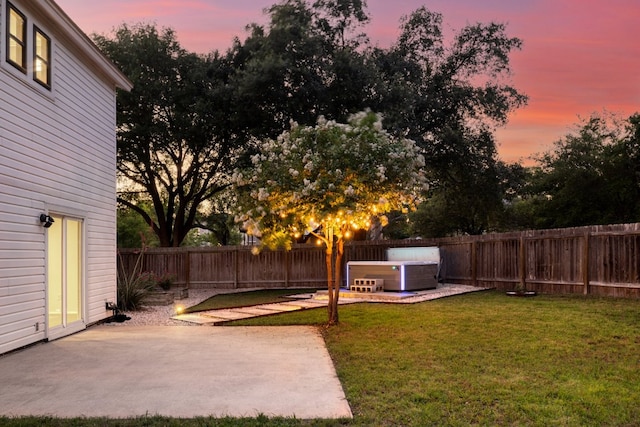 2616 Aylesbury Ln, Austin, TX 78745 - yard at dusk with a patio and a fenced backyard