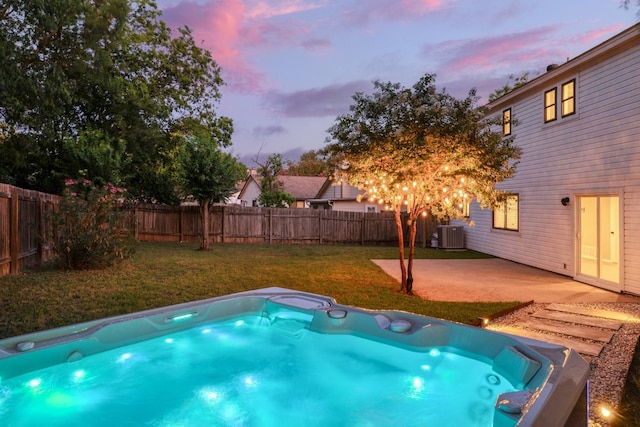 2616 Aylesbury Ln, Austin, TX 78745 - pool at dusk featuring a fenced backyard and a patio area