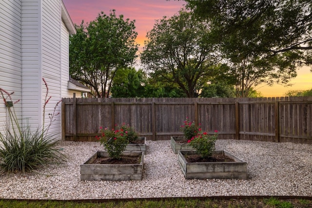 2616 Aylesbury Ln, Austin, TX 78745 - fenced yard featuring a garden