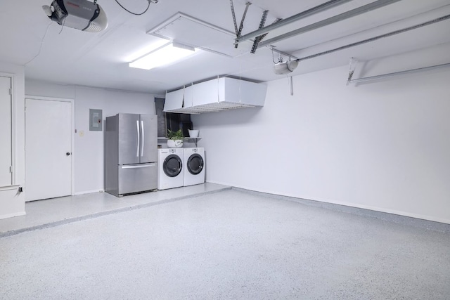 2616 Aylesbury Ln, Austin, TX 78745 - garage with freestanding refrigerator, separate washer and dryer, a garage door opener, and electric panel