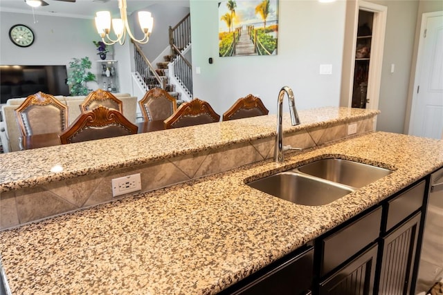 2471 Sunrise Rd Unit 35, Round Rock, TX 78664 - kitchen with light stone countertops, a chandelier, and open floor plan