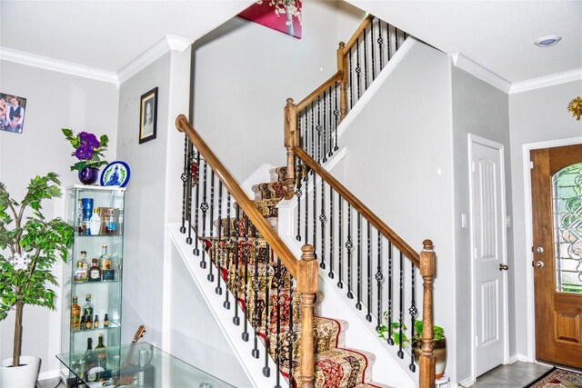 2471 Sunrise Rd Unit 35, Round Rock, TX 78664 - staircase featuring crown molding and bar area