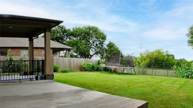 2471 Sunrise Rd Unit 35, Round Rock, TX 78664 - fenced backyard featuring a patio area and a trampoline