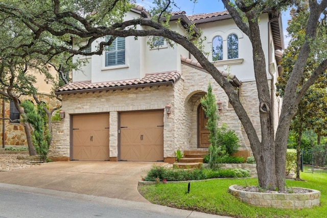 1036 Liberty Park Dr Unit 46, Austin, TX 78746 - mediterranean / spanish-style home with an attached garage, stone siding, a tile roof, stucco siding, and concrete driveway