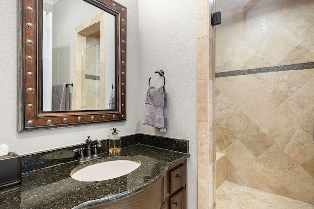 1036 Liberty Park Dr Unit 46, Austin, TX 78746 - full bathroom featuring a shower stall, vanity, and a textured wall
