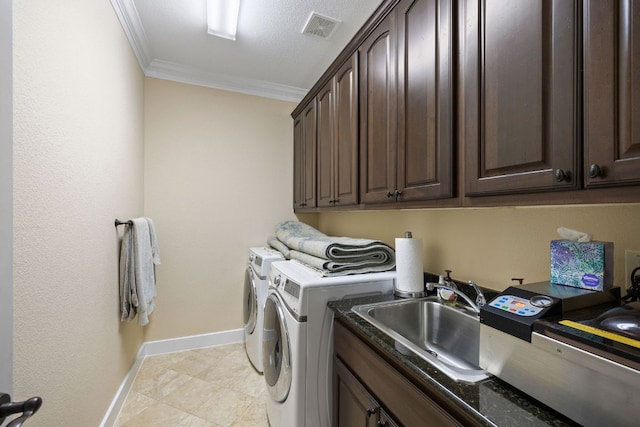 1036 Liberty Park Dr Unit 46, Austin, TX 78746 - laundry area featuring cabinet space, ornamental molding, independent washer and dryer, and light tile patterned floors
