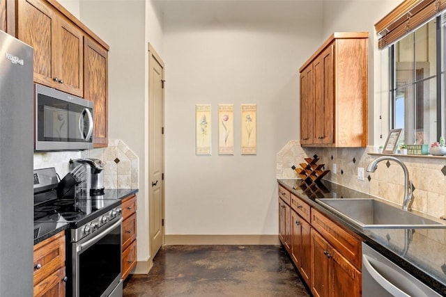 186 Sleepy Oaks Dr, Kingsland, TX 78639 - kitchen with appliances with stainless steel finishes, dark countertops, concrete flooring, tasteful backsplash, and brown cabinetry
