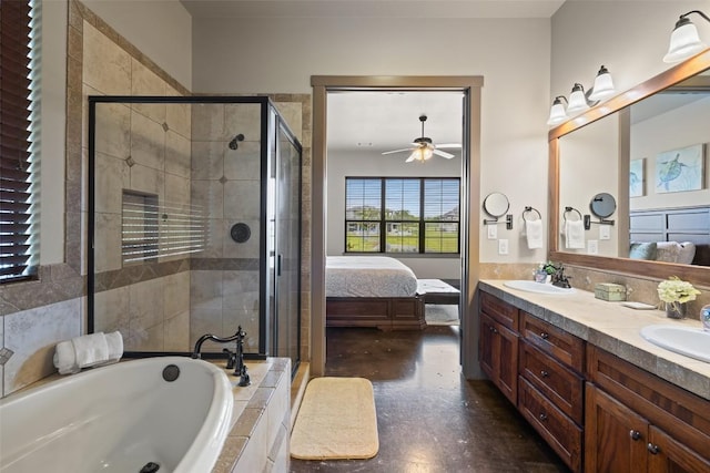 186 Sleepy Oaks Dr, Kingsland, TX 78639 - ensuite bathroom with a garden tub, double vanity, a shower stall, and a ceiling fan