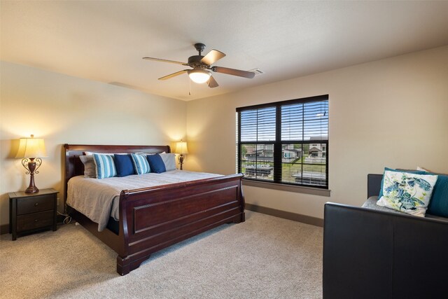 186 Sleepy Oaks Dr, Kingsland, TX 78639 - carpeted bedroom with baseboards and ceiling fan