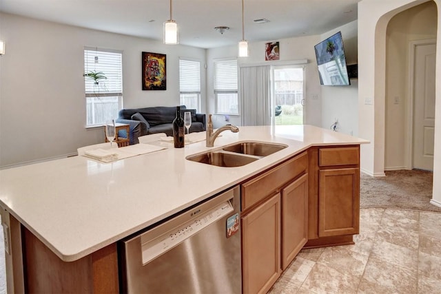 1928 Dragonfly Loop, Bastrop, TX 78602 - kitchen featuring dishwasher, light countertops, healthy amount of natural light, and hanging light fixtures