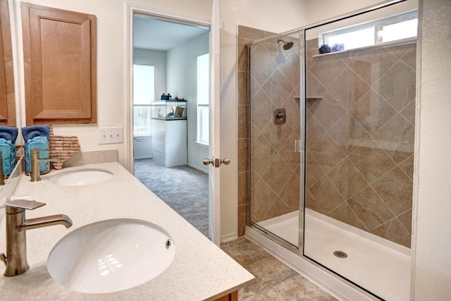 1928 Dragonfly Loop, Bastrop, TX 78602 - full bath with double vanity and a stall shower