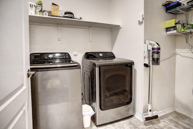 1928 Dragonfly Loop, Bastrop, TX 78602 - laundry area featuring washing machine and dryer and baseboards