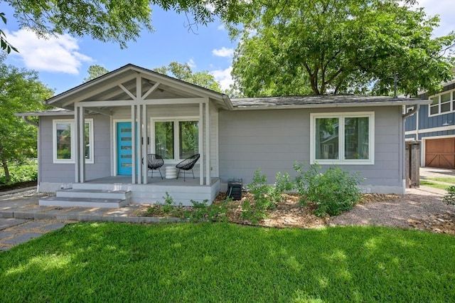 1010 Karen Ave, Austin, TX 78757 - view of front of house with covered porch and a front yard