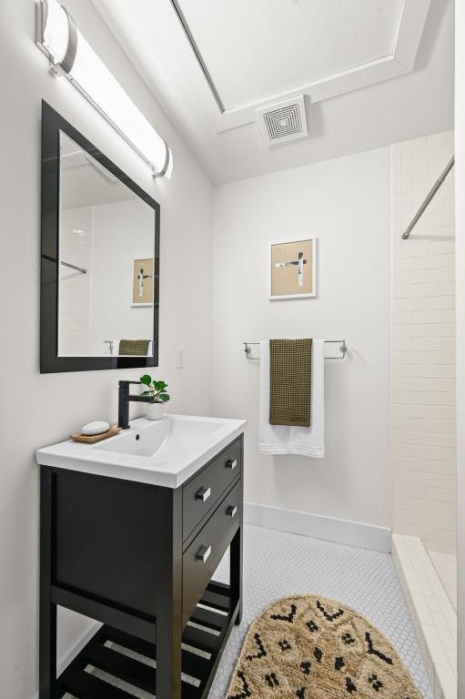 1010 Karen Ave, Austin, TX 78757 - full bath with vanity, a tile shower, and tile patterned floors