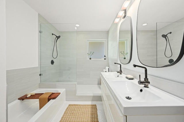 1010 Karen Ave, Austin, TX 78757 - full bath featuring a walk in shower, double vanity, a bath, and tile patterned flooring