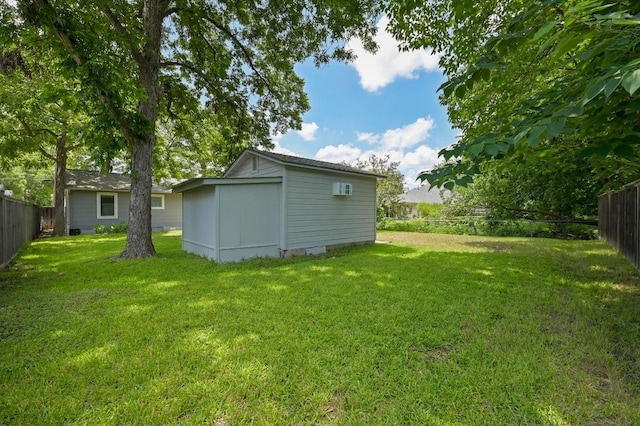1010 Karen Ave, Austin, TX 78757 - fenced backyard with an outdoor structure and a wall mounted AC