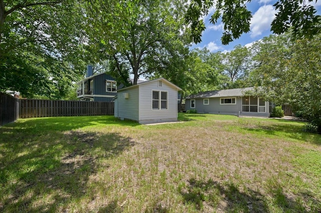 1010 Karen Ave, Austin, TX 78757 - fenced backyard featuring an outdoor structure