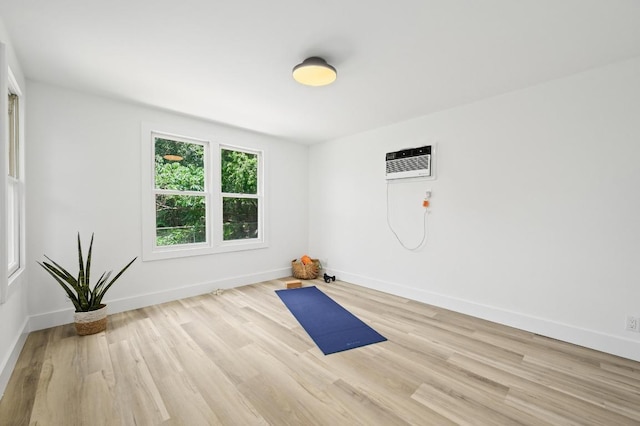 1010 Karen Ave, Austin, TX 78757 - workout area with a wall mounted AC and wood finished floors