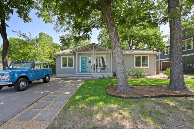 1010 Karen Ave, Austin, TX 78757 - view of front facade with a front lawn and concrete driveway
