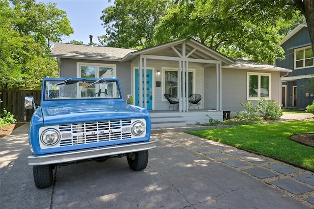 1010 Karen Ave, Austin, TX 78757 - view of front facade featuring covered porch and roof with shingles