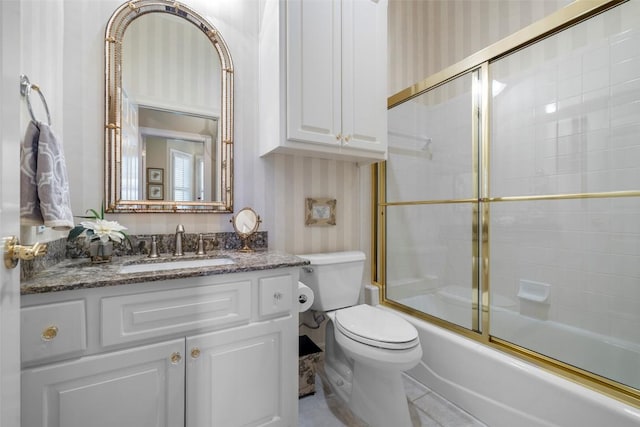 7815 Moritz Ln, Austin, TX 78731 - bathroom featuring vanity, bath / shower combo with glass door, and wallpapered walls