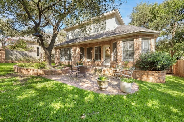 7815 Moritz Ln, Austin, TX 78731 - back of property featuring a patio area and brick siding